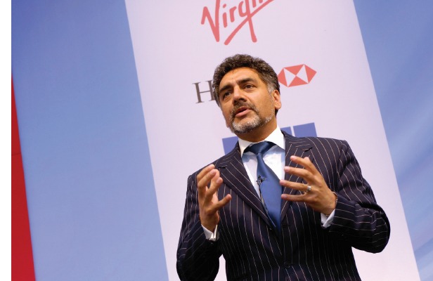 James Caan speaking at a business event with Virgin and HSBC branding