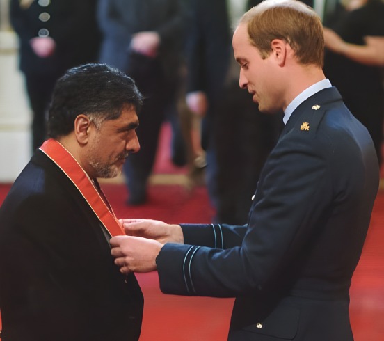Prince William presenting James Caan with his CBE at Buckingham Palace
